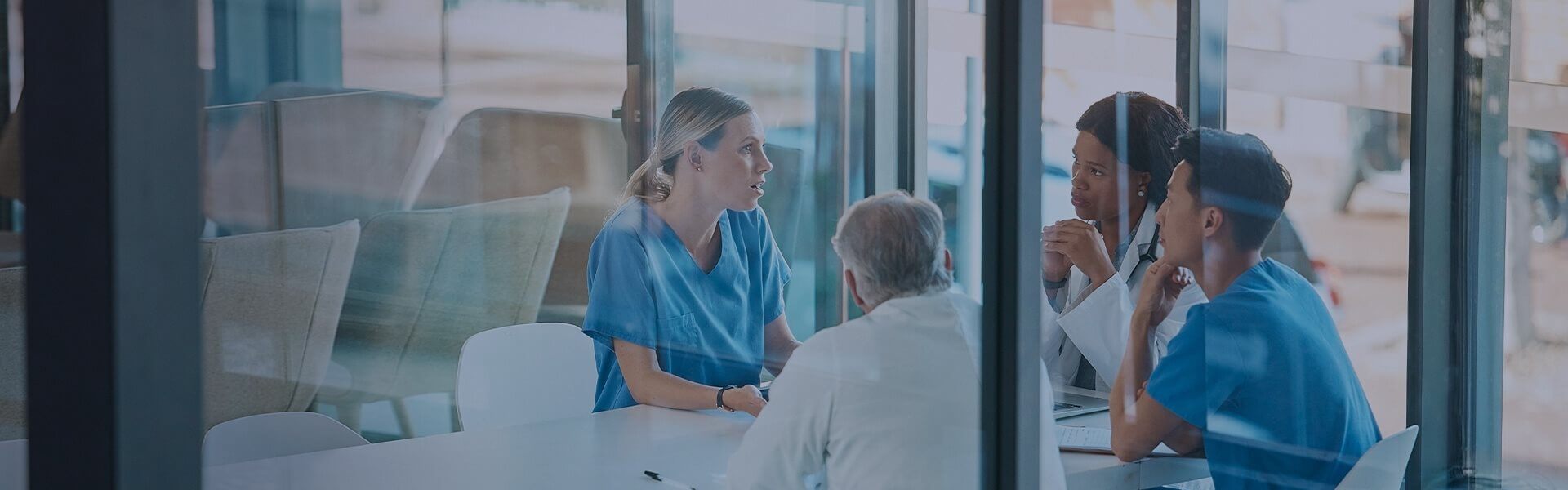 Image of health workers attending an investigation meeting