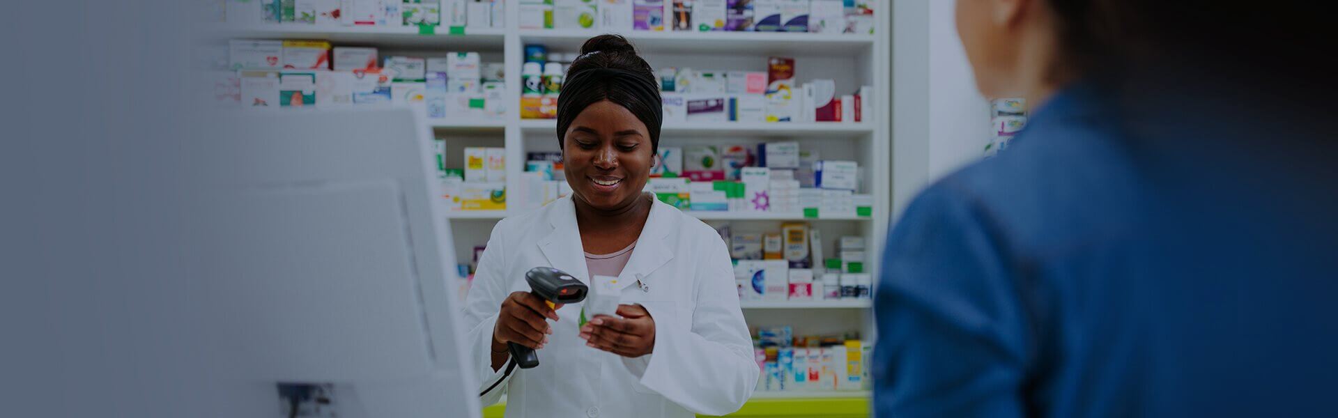 Image of pharmacist selling medicine