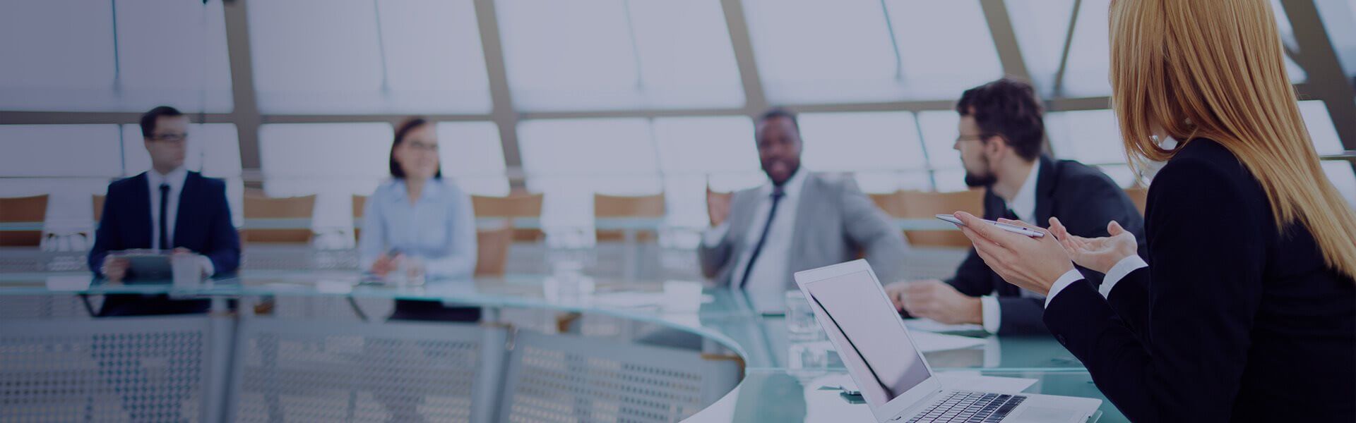 an image to show colleagues sat around a meeting table