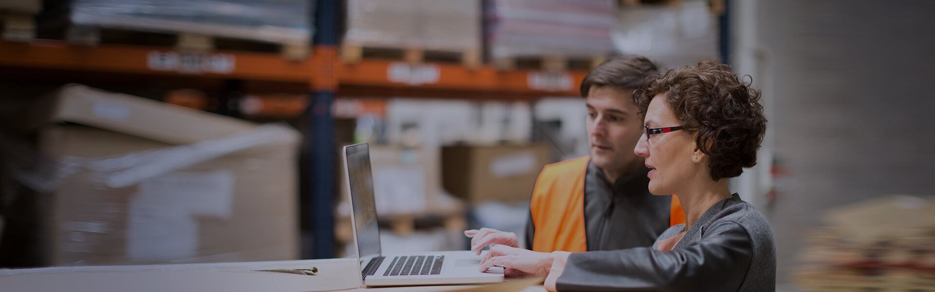 an image to show two people in a factory